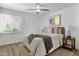 Stylish bedroom featuring a ceiling fan, natural light, and a cozy rug creating a serene space at 6009 N 79Th St, Scottsdale, AZ 85250