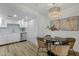 Dining area features chandelier and chairs; kitchen with stainless steel appliances at 6009 N 79Th St, Scottsdale, AZ 85250