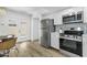 Modern kitchen features stainless steel appliances and an adjacent dining nook at 6009 N 79Th St, Scottsdale, AZ 85250