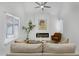 Bright living room features vaulted ceiling, modern fireplace and stylish decor at 6009 N 79Th St, Scottsdale, AZ 85250