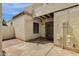 Enclosed back patio with a mix of stone and brick pavers and stucco walls at 6009 N 79Th St, Scottsdale, AZ 85250