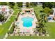 Community pool with ample lounge seating, adjacent hot tub, and well-maintained landscaping at 6009 N 79Th St, Scottsdale, AZ 85250