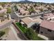 An aerial view of a single story house with a grass backyard and covered patio at 6228 S Nash Way, Chandler, AZ 85249