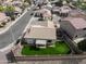 Aerial view of a private backyard, featuring a grass lawn, patio, and playground at 6228 S Nash Way, Chandler, AZ 85249