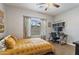 Bedroom featuring modern decor with a desk, window, and wooden vinyl flooring at 6228 S Nash Way, Chandler, AZ 85249