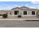 Inviting single-story home with a neutral facade, tiled roof, and desert-style landscaping at 6228 S Nash Way, Chandler, AZ 85249
