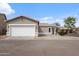 Attached two-car garage and paved driveway offer convenient parking at this single-story home at 6228 S Nash Way, Chandler, AZ 85249
