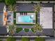 Aerial view captures a pristine backyard with a pool, putting greens, lounging and a basketball court at 6301 N 16Th Dr, Phoenix, AZ 85015