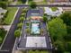 A bird's eye view of a backyard with a pool, putting greens, a sports court, and landscaping at 6301 N 16Th Dr, Phoenix, AZ 85015