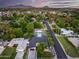 Scenic aerial view of the property featuring its pool, lush landscaping, and panoramic views of the surroundings at 6301 N 16Th Dr, Phoenix, AZ 85015