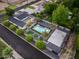 Aerial shot of a backyard pool, lounge area, putting greens, sports court, and desert landscaping for relaxation at 6301 N 16Th Dr, Phoenix, AZ 85015