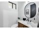 Chic bathroom with a modern sink and faucet, with a view to the window at 6301 N 16Th Dr, Phoenix, AZ 85015