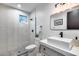 Modern bathroom featuring white subway tile shower, gray tile floor, and stylish vanity with a rectangular sink at 6301 N 16Th Dr, Phoenix, AZ 85015