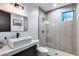 Stylish bathroom with modern fixtures, including a rectangular sink and glass enclosed shower with subway tile at 6301 N 16Th Dr, Phoenix, AZ 85015