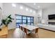 Bright dining room with floor to ceiling windows and view to the backyard and open floor plan at 6301 N 16Th Dr, Phoenix, AZ 85015