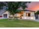 Inviting home exterior features a well-manicured lawn, stylish lighting, and a charming covered entrance at 6301 N 16Th Dr, Phoenix, AZ 85015