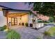 A modern exterior featuring a covered entrance, hardscape, and fresh landscaping at 6301 N 16Th Dr, Phoenix, AZ 85015