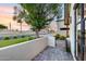 Charming front yard with lush landscaping, mature trees, and a paved walkway leading to the entrance at 6301 N 16Th Dr, Phoenix, AZ 85015