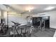 Spacious home gym with a variety of workout equipment, including a treadmill, weights, and training machines at 6301 N 16Th Dr, Phoenix, AZ 85015