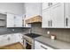 Kitchen featuring stainless steel appliances, gray countertops, and white cabinets at 6301 N 16Th Dr, Phoenix, AZ 85015
