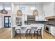 Bright kitchen featuring marble island, stainless steel appliances, stylish pendant lighting, and ample counter space at 6301 N 16Th Dr, Phoenix, AZ 85015