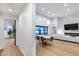 Bright, open-concept living space with high ceilings, modern lighting, and a cozy fireplace, perfect for gatherings at 6301 N 16Th Dr, Phoenix, AZ 85015