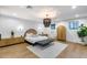 Luxurious main bedroom featuring stylish decor, ambient lighting, and a comfortable layout for relaxation and elegance at 6301 N 16Th Dr, Phoenix, AZ 85015