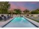 A refreshing pool and lounging area is complemented by palm trees, a basketball court and putting green at 6301 N 16Th Dr, Phoenix, AZ 85015