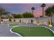 A perfectly manicured putting green invites relaxation among the carefully chosen plants and landscaping at 6301 N 16Th Dr, Phoenix, AZ 85015