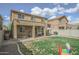 Spacious backyard with covered patio, an outdoor grill and well-maintained lawn at 6749 W Charter Oak Rd, Peoria, AZ 85381