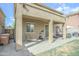 A spacious covered patio complete with lounge chair and exercise equipment at 6749 W Charter Oak Rd, Peoria, AZ 85381