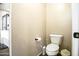 A simple bathroom with toilet and vanity with view to adjacent bathroom with tub and shower at 6749 W Charter Oak Rd, Peoria, AZ 85381
