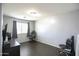 Empty bonus room featuring laminate wood flooring and gray walls at 6749 W Charter Oak Rd, Peoria, AZ 85381