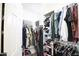 A well-organized walk-in closet with clothes racks and shelves providing ample storage space at 6749 W Charter Oak Rd, Peoria, AZ 85381