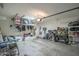 The garage has ample storage with overhead racks and wall-mounted shelving at 6749 W Charter Oak Rd, Peoria, AZ 85381