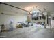 This is a well-lit garage with ample space for storage and organization at 6749 W Charter Oak Rd, Peoria, AZ 85381