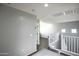 Second floor hallway leading to bedrooms and loft area at 6749 W Charter Oak Rd, Peoria, AZ 85381