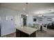 Spacious kitchen with island flowing into the dining and living areas, perfect for entertaining at 6749 W Charter Oak Rd, Peoria, AZ 85381