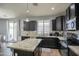Well-equipped kitchen with a center island, modern appliances, and plenty of counter space at 6749 W Charter Oak Rd, Peoria, AZ 85381