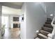 View of the staircase leading to the upper level with natural light and modern design at 6749 W Charter Oak Rd, Peoria, AZ 85381
