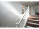 Carpeted stairway with white railing to the second floor at 6749 W Charter Oak Rd, Peoria, AZ 85381
