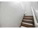 Carpeted stairway with white railing at 6749 W Charter Oak Rd, Peoria, AZ 85381