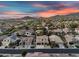 Panoramic aerial view of a residential neighborhood nestled amongst mountains with houses and a scenic landscape at 7354 E Norwood St, Mesa, AZ 85207