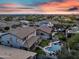 Aerial view of the backyard showcasing a sparkling pool, lush landscaping, and a covered patio for outdoor entertaining at 7354 E Norwood St, Mesa, AZ 85207