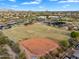 Aerial view of community with baseball field, park and trees at 7354 E Norwood St, Mesa, AZ 85207