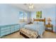 This bedroom features a window, ceiling fan, queen sized bed, and colorful decor at 7354 E Norwood St, Mesa, AZ 85207
