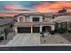 Stunning two-story home with a three-car garage, well-maintained landscaping, and beautiful sunset views at 7354 E Norwood St, Mesa, AZ 85207