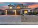 Charming home exterior showcasing a spacious three-car garage and well-maintained landscaping at 7354 E Norwood St, Mesa, AZ 85207