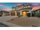 Elegant two-story home exterior with three-car garage and desert landscaping at 7354 E Norwood St, Mesa, AZ 85207
