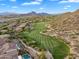 Scenic aerial view of a lush golf course surrounded by beautiful homes at 7354 E Norwood St, Mesa, AZ 85207